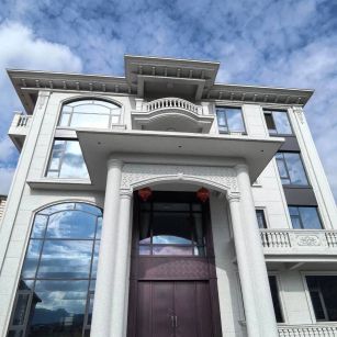 哈密白麻别墅外墙干挂石材效果示例