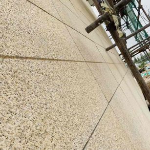 哈密 黄金麻花岗岩荔枝面外墙干挂石材效果示例